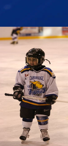 A young boy playing hockey